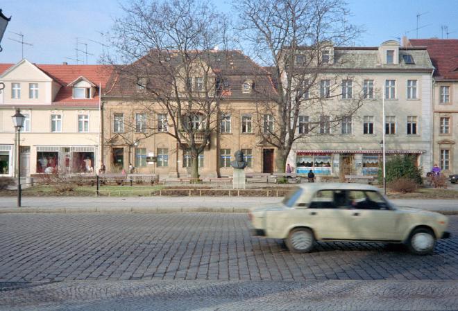 A Trabant 'speeds' along a street