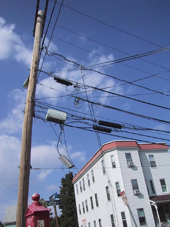 Some cabling hanging from a utility pole