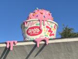 Giant melting ice cream on a building roof